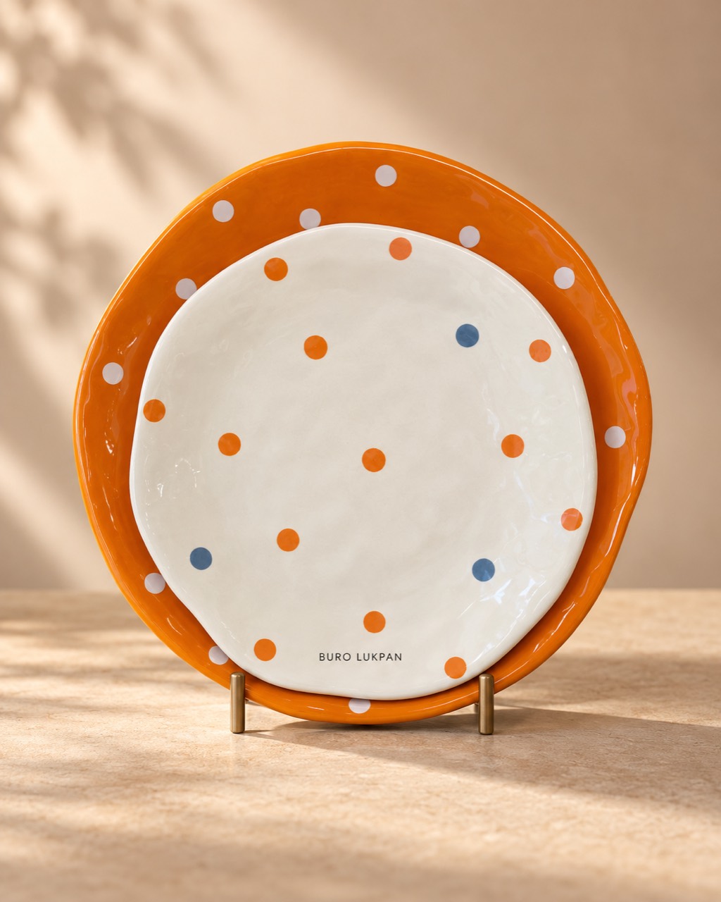 Orange and white polka-dot plates: BURO LUKPAN product photograph